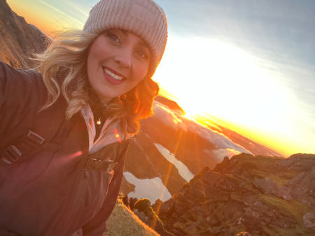 Make It Mersey Cares - Rachel Munn smiling at camera with sunrise in the background