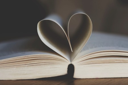 A book with the pages folded into a heart shape